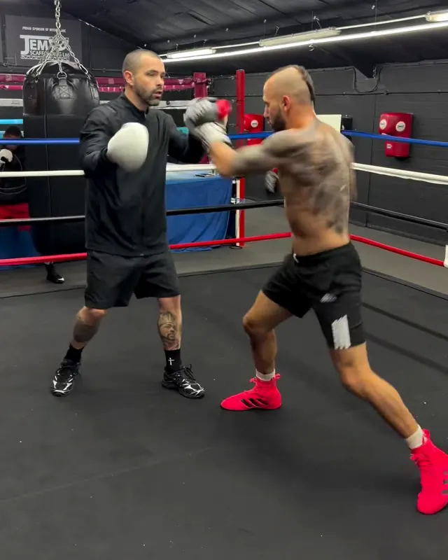 Ege Konuk working pads with Marlee Dann at Intense Boxing